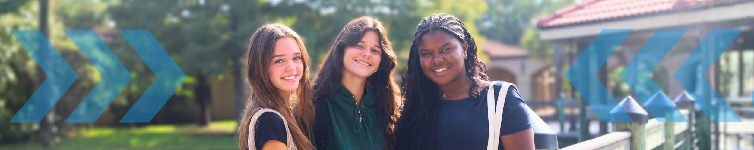 sjr state students talking on campus sidewalk