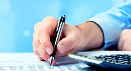 Account hand, pen, and spreadsheets with calculator