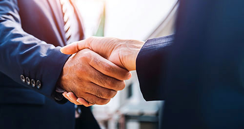 Business Specialist Handshake in suits