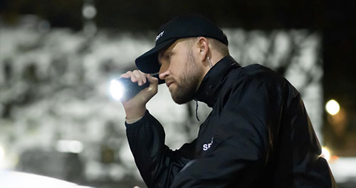 Homeland Security Specialist with flashlight