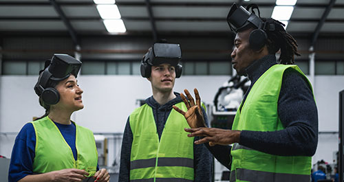 Three people with virtual equipment on head and safety vest
