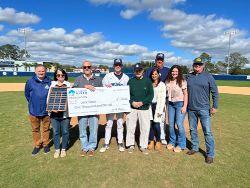 Slater receives scholarship check