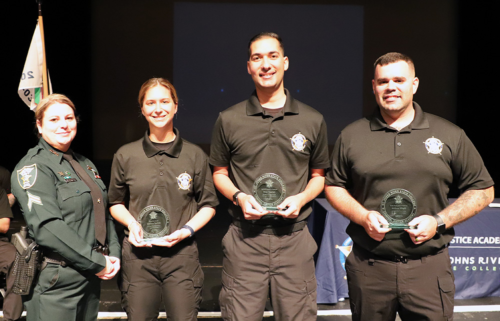 Criminal Justice Academy award winners: Law Enforcement Coordinator Threasa Owens, with DeAnna Bertola (Medallion Award); Belal Saadeh (Academic Achiever award for the highest GPA); and Andrew Wright (Most Proficient in Firearms award).