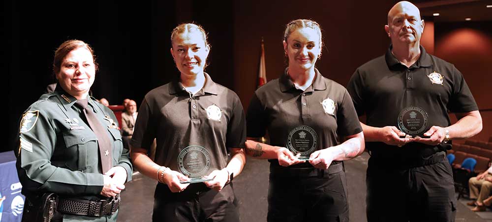 SJR State criminal justice instructor Threasa Owens, Kyleigh Gallagher, Alyssa Mashburn, Sean Schlobohm