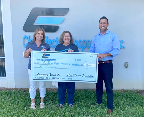 Clay Electric group photo with big check