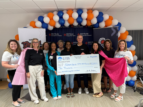HCA group photo with big check