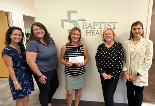 baptist health donation, group holding large check